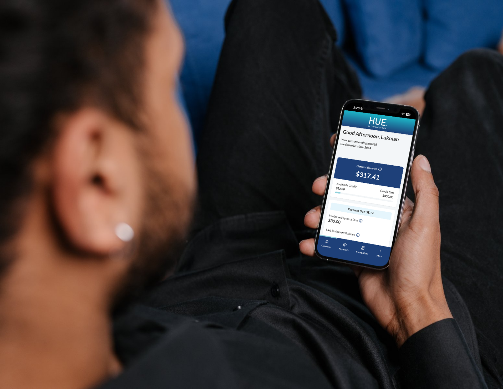 person using the hue mobile app
